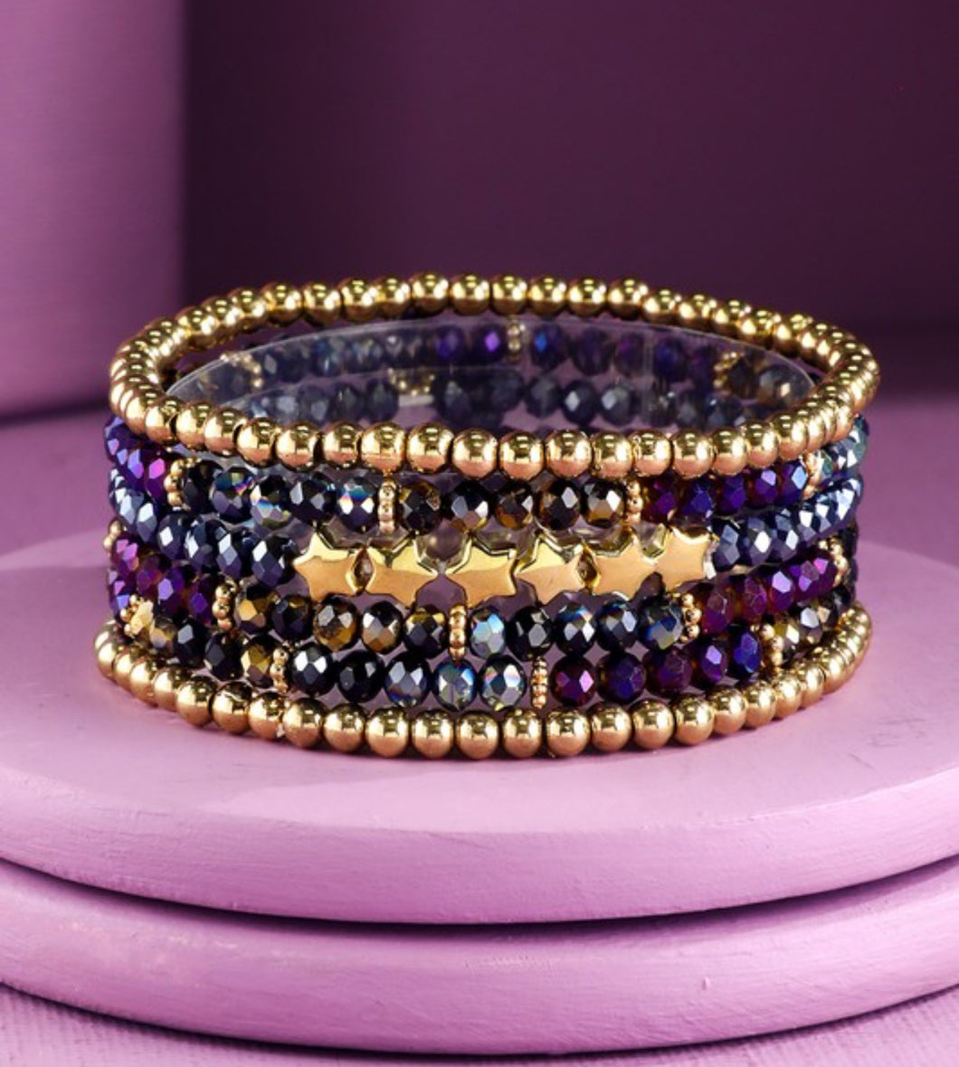 Dark purple stackable beaded bracelets with stars