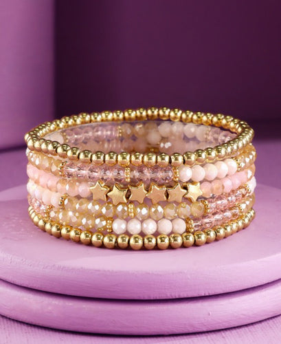 Pink stackable beaded bracelets with stars